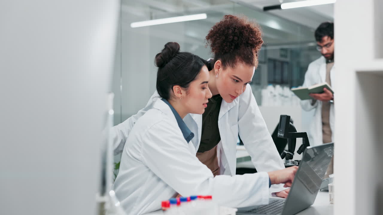 Two Female Scientists Working in a Lab