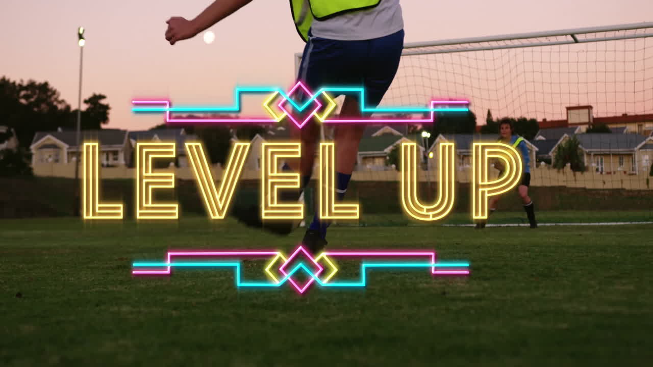 Kicking soccer ball, player with Level Up animation text on field