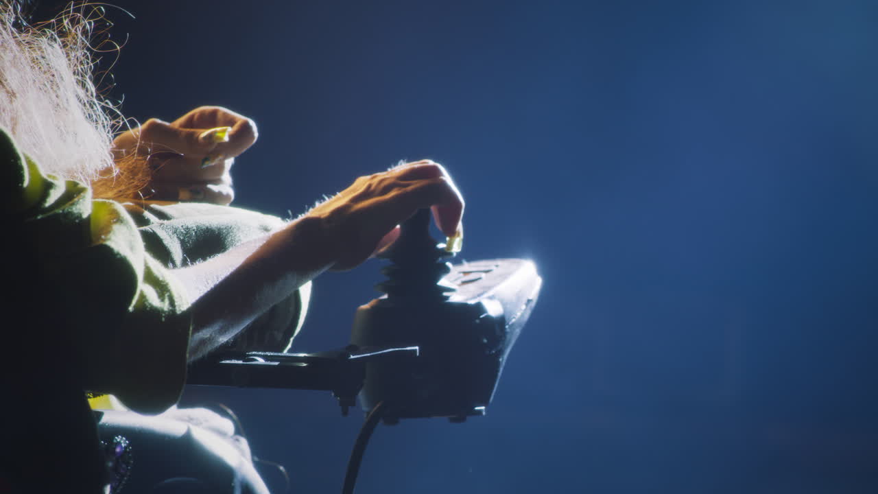 Woman in Wheelchair Using Adaptive Gaming Controller