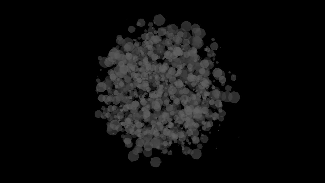 Un'esplosione di fuoco arancione in rapida espansione si trasforma in nuvole di fumo grigio e particelle di polvere che si dissolvono