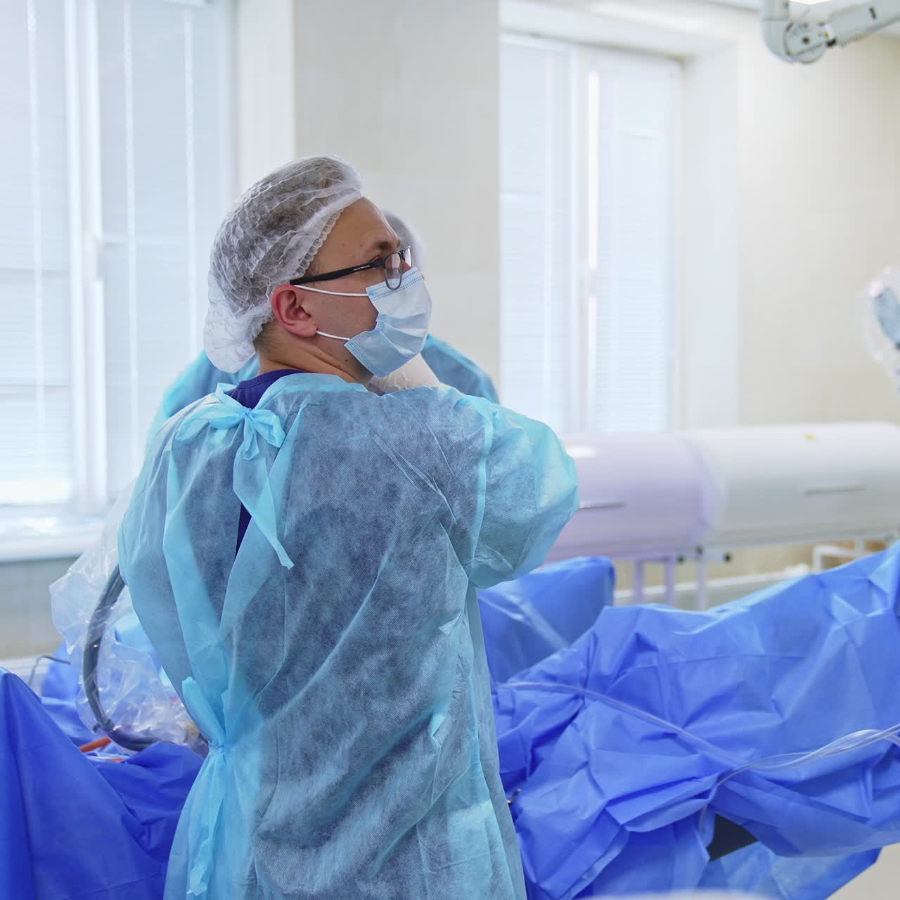 New modern surgery room. Surgical specialists working in hospital ward