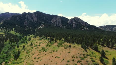 aerial falling shot of amazing mountains, colorado springs, usa, drone view