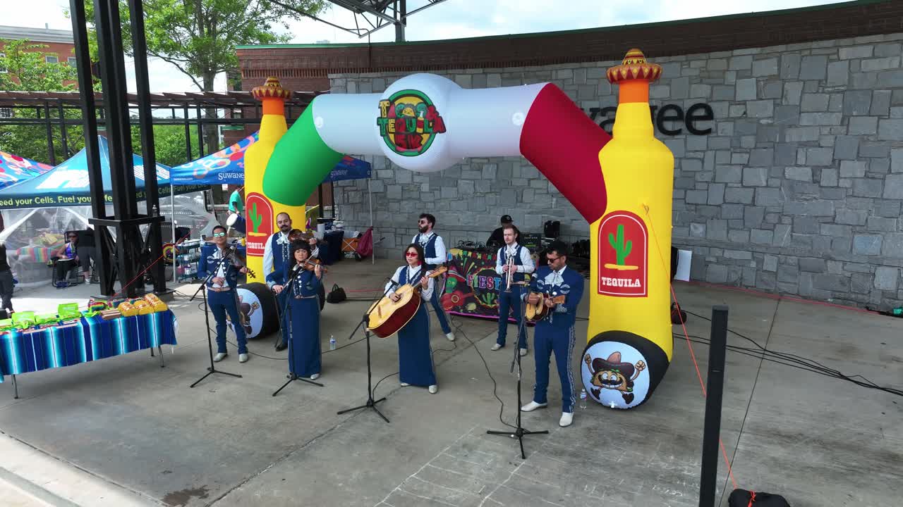 Local Band Entertaining Attendees At Tacos And Tequila Event In Suwanee, Georgia. drone pullback shot