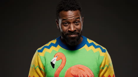 man in flamingo sweater portrait