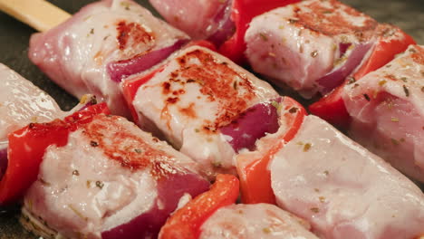 cooking pork and red pepper skewers