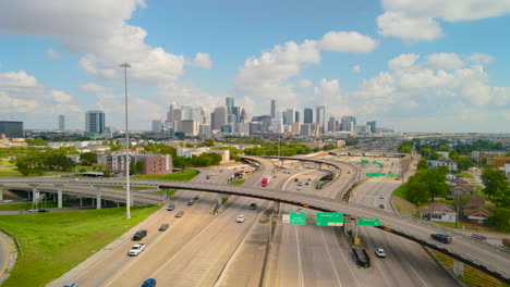 drone fly interstate texas highway 288 downtown houston texas, daylight skyline aerial view. aerial highway 288 and interstate 69 intersection overlooking downtown houston