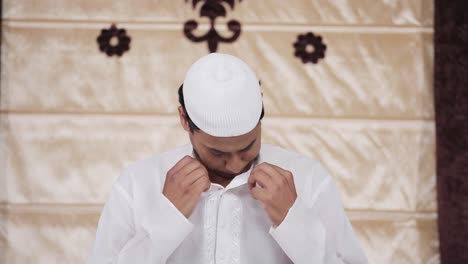 indian man doing rituals of ramadan prayer