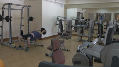 two people working out in fitness center