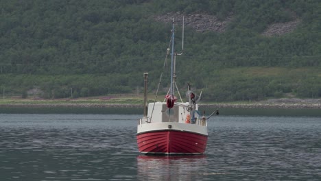 A-Wooden-Trawler-Boat-Over-Sea-Near-Medby,-Senja-Norway