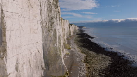 aerial shot along the white chalk seven sisters cliffs