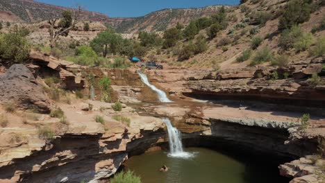 tourists at toquerville falls on hot summer day in utah, usa