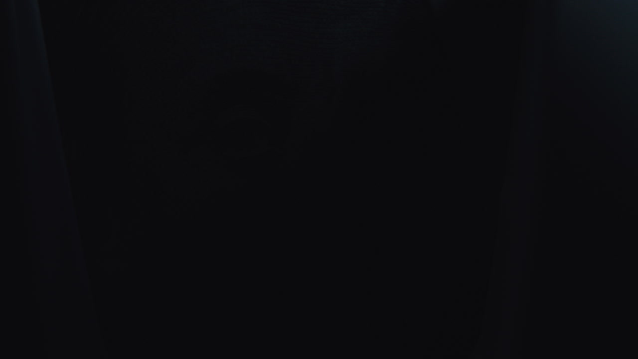 Close-up of black fabric and a dollar bill