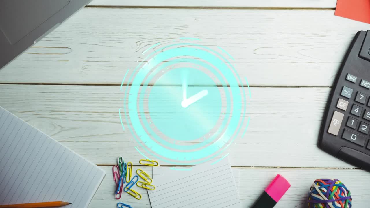 책상 위에 노트북과 계산기가 있는 책상 위로 움직이는 시계의 애니메이션