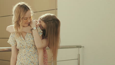 two women hugging outdoors