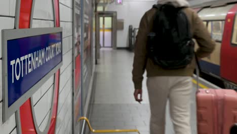 leaving tottenham court road station, london, united kingdom