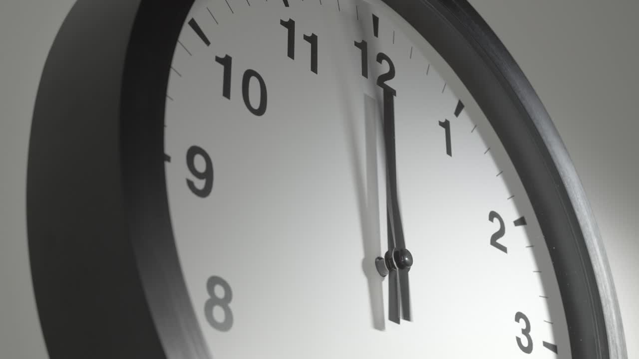 Clock Face in Time Lapse on White Wall in Office