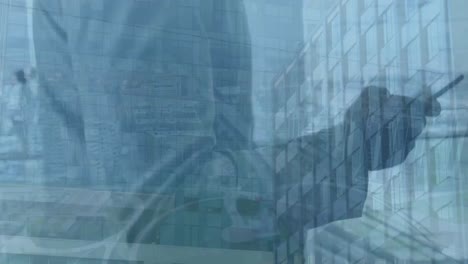 animación del paisaje urbano sobre un hombre afroamericano usando un teléfono inteligente.