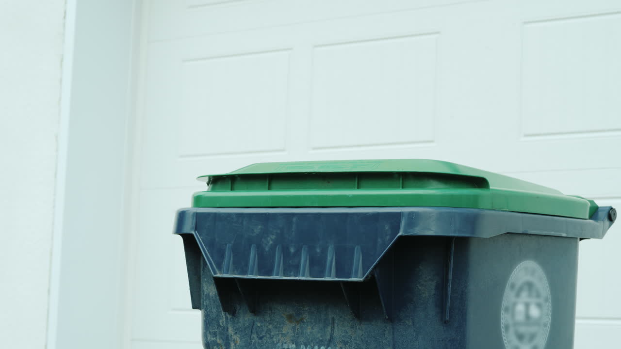 Homeowner Dumps Household Rubbish In A Container Near House 01