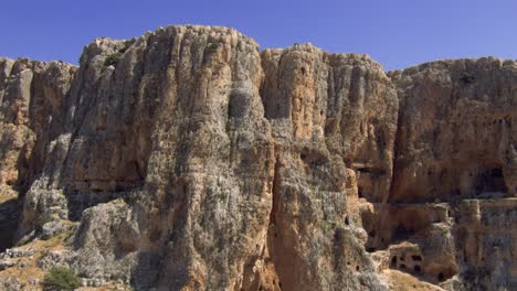 the beautiful rock formation of the arbel cliff mountain in israel - low aerial