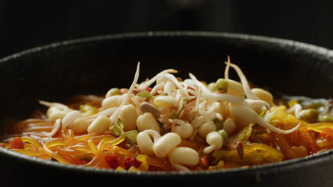 delicious vegetarian noodle soup with sprouts
