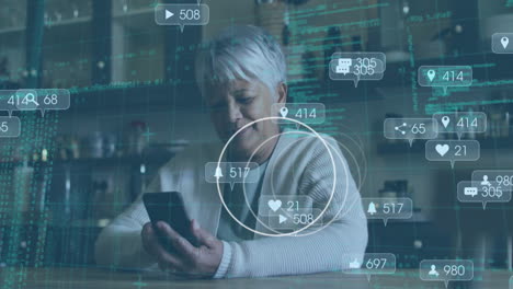 animation of social media icons and data processing over senior woman using smartphone