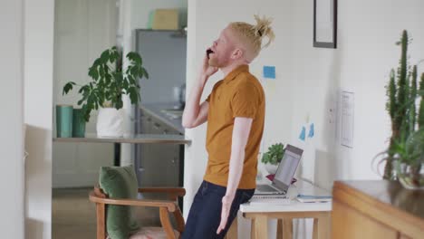 Albino-african-american-man-with-dreadlocks-making-call