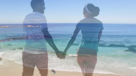 Animation-of-happy-african-american-couple-walking-on-beach