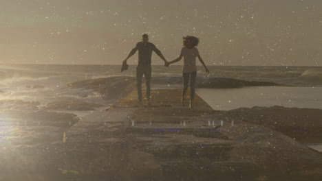 couple holding hands on pier at sunset, with animated chart and heart icon showing technology