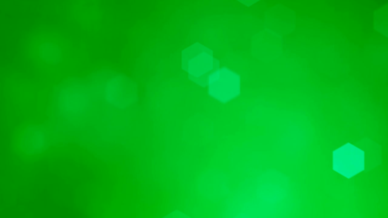 Glittering soft green hexagonal bokeh background animation. 4k Resolution, Glowing Light Particles