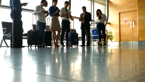 commuters using mobile phone