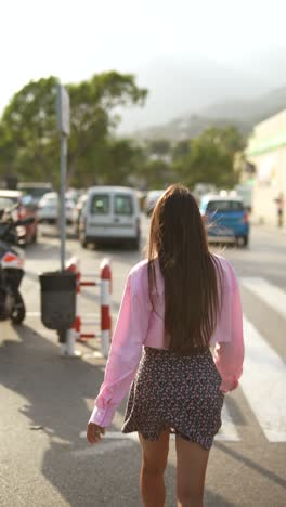 woman walking in a parking lot