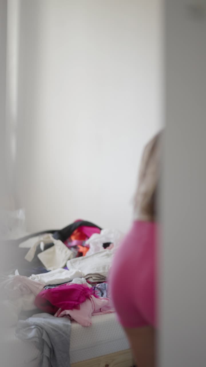 Woman in a messy bedroom