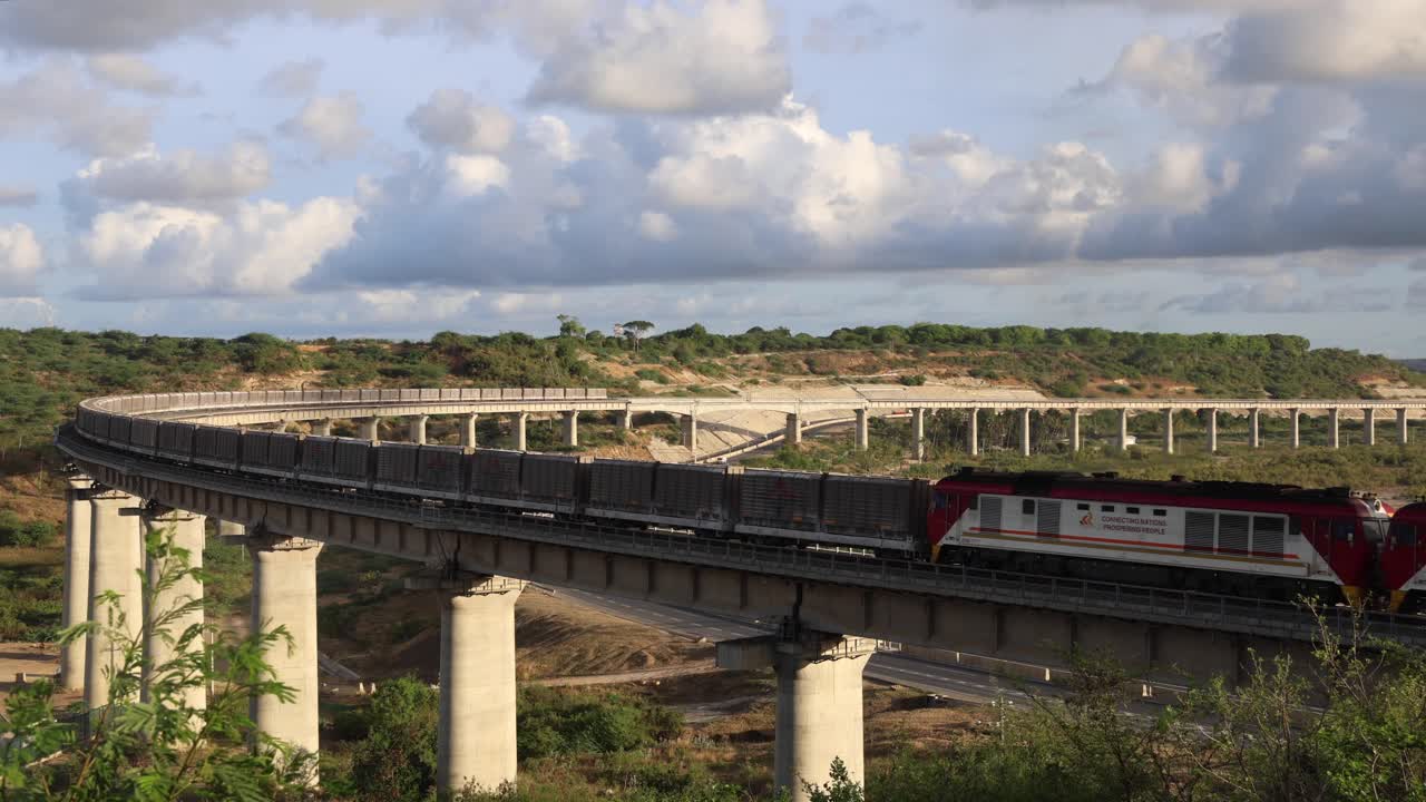 A standard gauge railway train carrying containers of cargo from the port of Mombasa