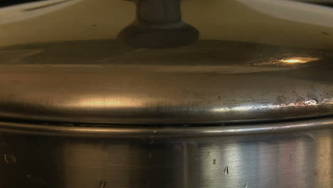 boiling hot water bubbles out of a cooking pot