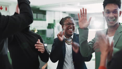 business team celebrates success with high fives