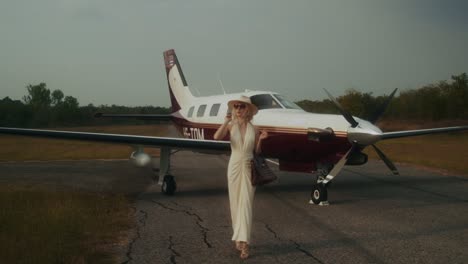 woman walking towards a private jet
