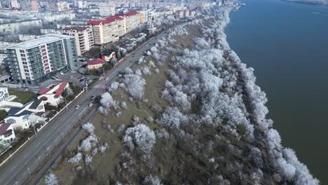 Winter-Trees-And-City-Buildings-Along-Danube-River-In-Galati,-Romania