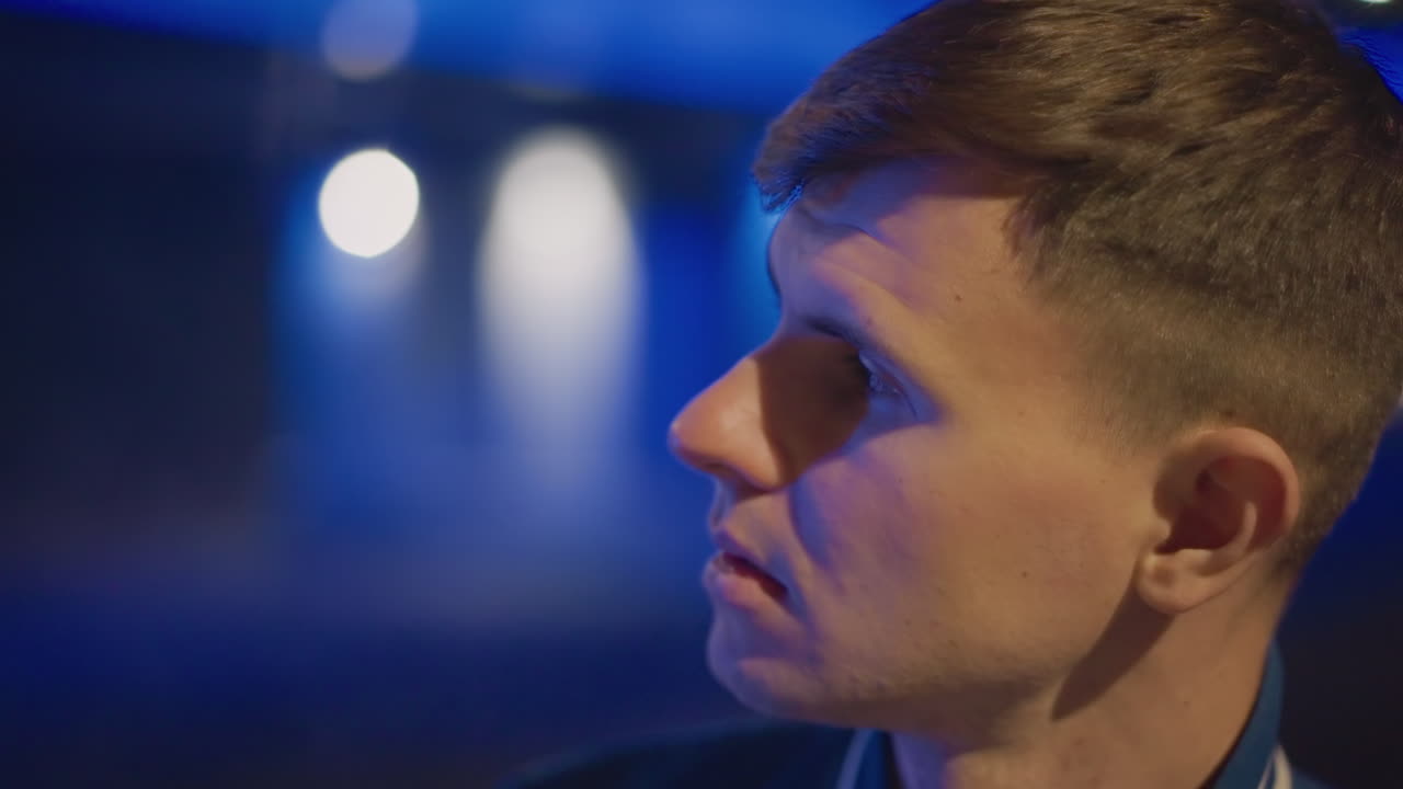 white man exhaling vapor under bridge glow, solitary nightwalker scanning skyline, contemplative stare in profile, drifting vapor illuminated by neon, cinematic blue tones, quiet urban atmosphere