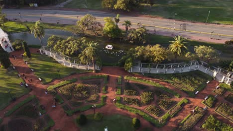 pergola bridge and white boat on lake in rosedal or rose garden, tres de febrero park at buenos aires in argentina