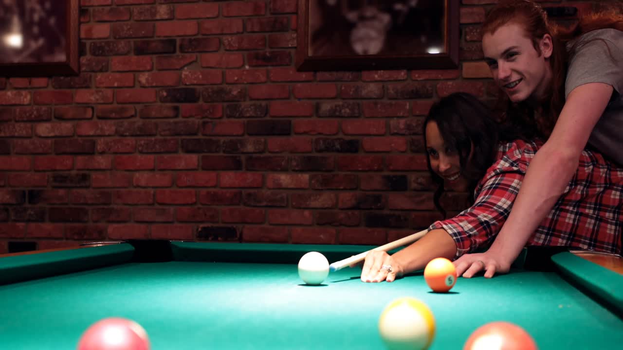 Couple playing snooker in night club 4k
