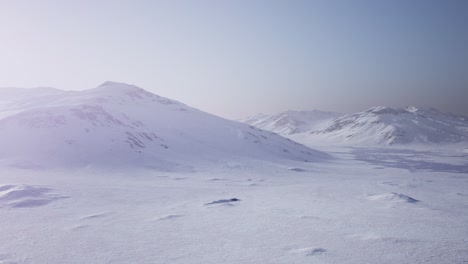 Aerial-Landscape-of-snowy-mountains-and-icy-shores-in-Antarctica