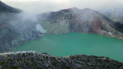 aerial view of kawah ijen volcano crater lake in indonesia