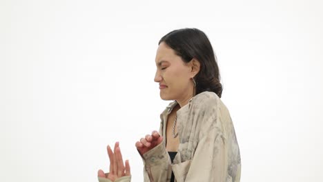 woman showing disgust or aversion with a 'stop' hand gesture