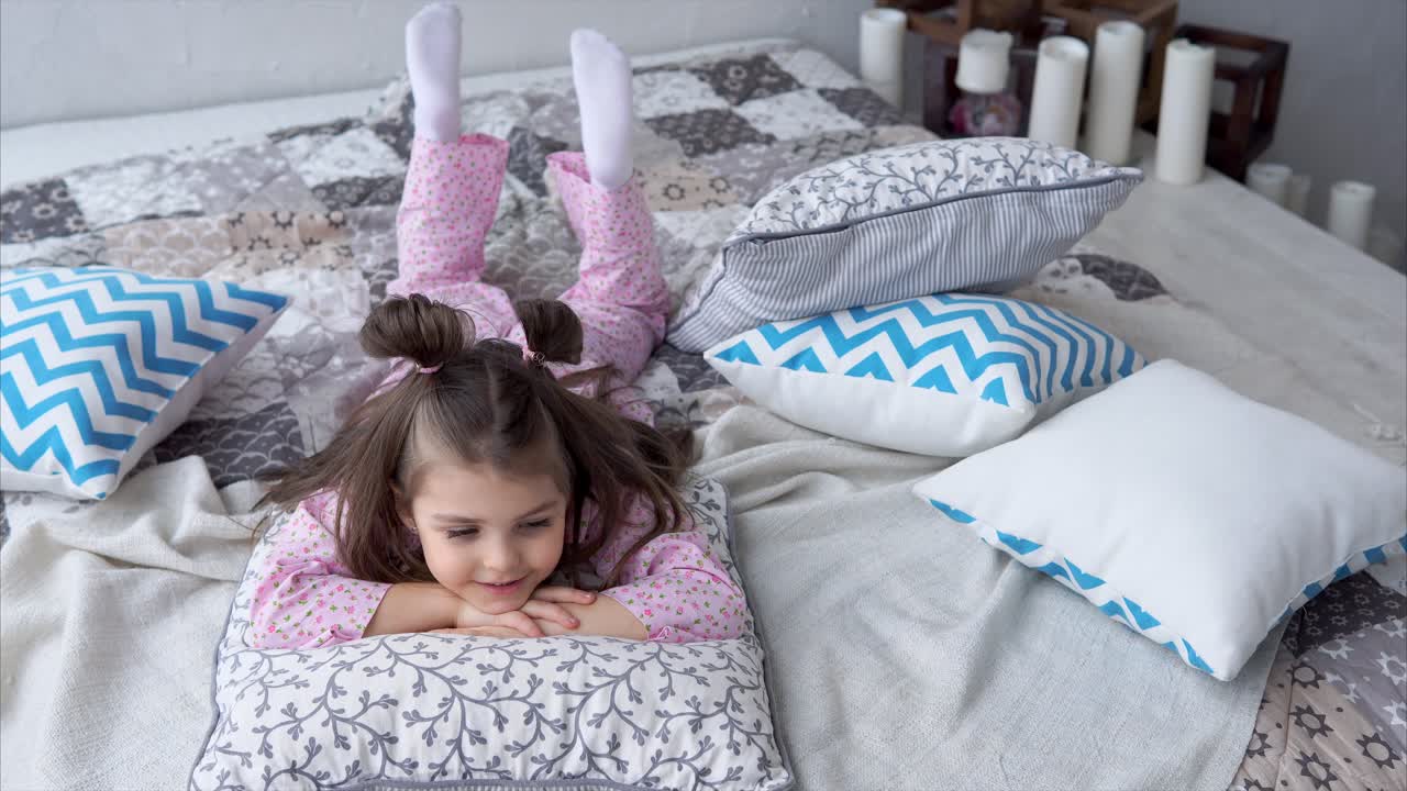Girl Lying on Bed in Pajamas
