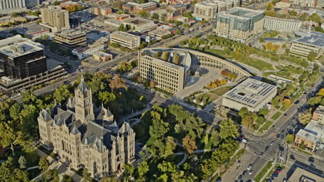 salt lake city utah aerial v19 birds eye view of town hall and public library, tilt up panning shot reveals downtown cityscape and hillside landscape - shot with inspire 2, x7 camera - october 2021