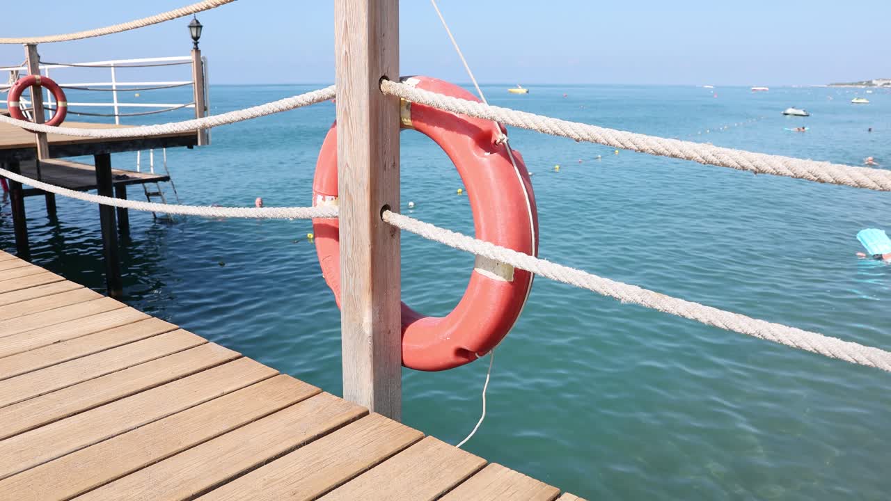 Lifebuoy on a pier by the sea