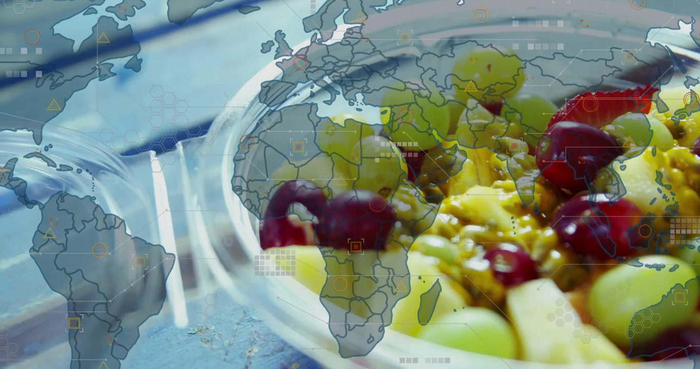Frisk frugtsalat med globalt kort og digitalt teknologi-overlay