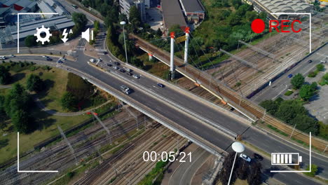 aerial view of highway and railway tracks with animation of recording timer