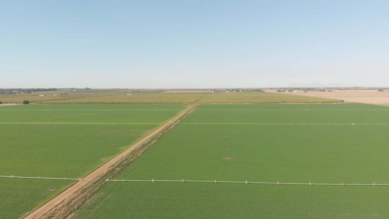Aerial flight over the life giving irrigated fields of Southern California vegetable fields