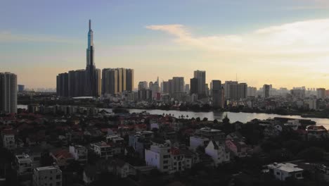 Sunset-rising-drone-shot-of-Ho-Chi-Minh-City,-Vietnam